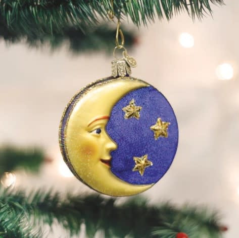 3.25-inch Man in the Moon ornament with a white celestial figure silhouette against a dark background.