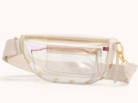 White Calla Lily crossbody bag with clear TPU body, black leather trim, and brushed gold hardware.