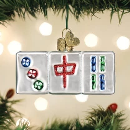 Mahjong ornament featuring a traditional tile with red bamboo patterns on white ceramic.