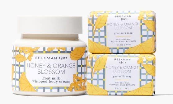 Gift set with honey soap bars and whipped body cream in apricot packaging.