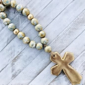 Large cross pendant on a 24-inch beaded necklace with blessing text.