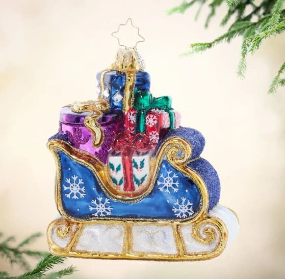Handcrafted Starry Night Sleigh ornament with twinkling star pattern on dark blue silhouette.