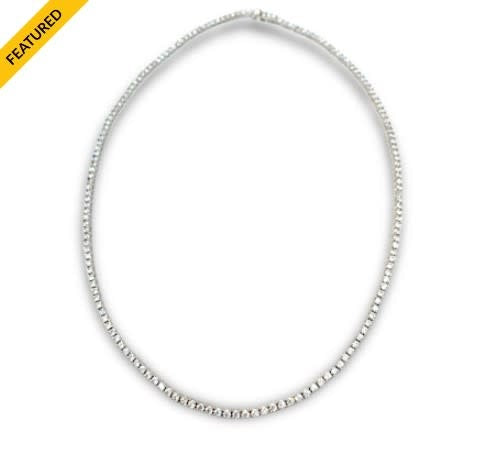 London Tennis necklace with white gold finish over brass featuring sparkling clear stones in a classic box closure design.