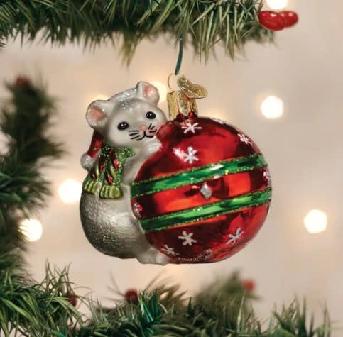 3-inch wide Christmas mouse ornament in red with white belly, black ears, holding a green bauble.