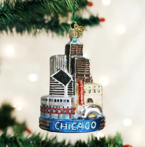 4.25-inch Chicago Christmas ornament featuring a festive red bauble with white snowflake patterns and gold accents.