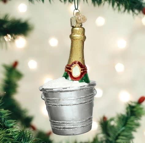 Chilled Champagne Ornament: a festive bottle-shaped decoration with ice and water inside.