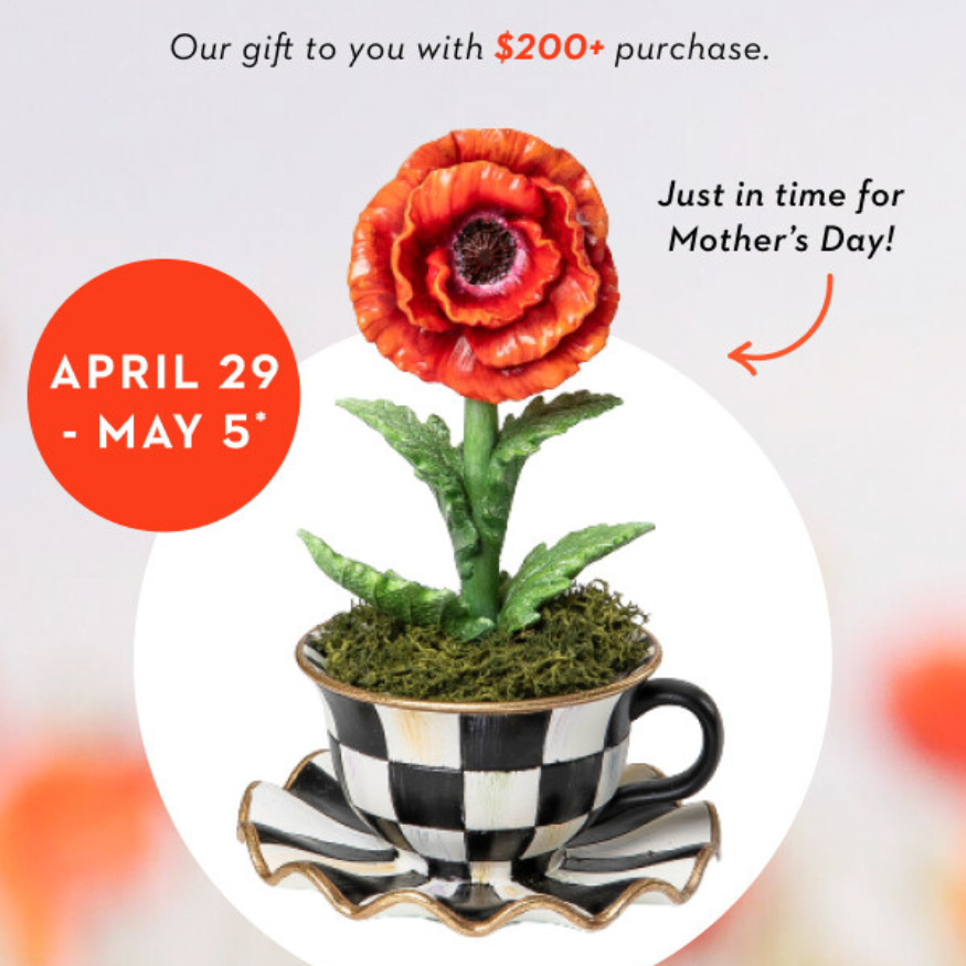 Teacup Poppy ceramic mug with a delicate poppy floral pattern on the exterior and a smooth white interior.