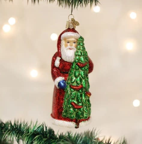 Santa Claus ornament with red suit holding three calling birds