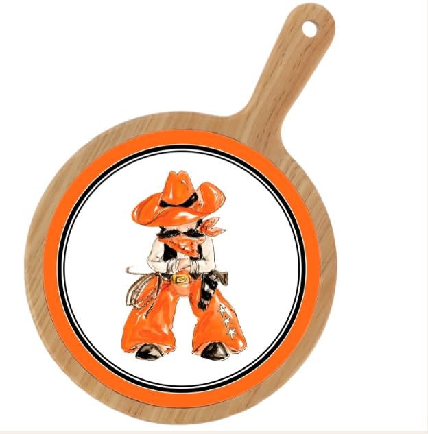 Orange wooden cheeseboard with cowboy boot silhouettes on a rustic background
