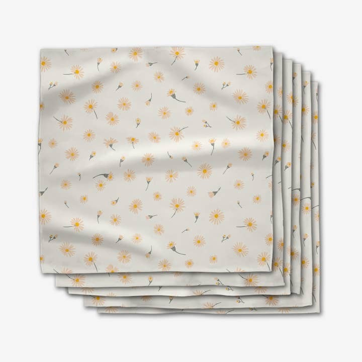 Set of six square Geosuede dinner napkins with single-sided geometric print in neutral tones.