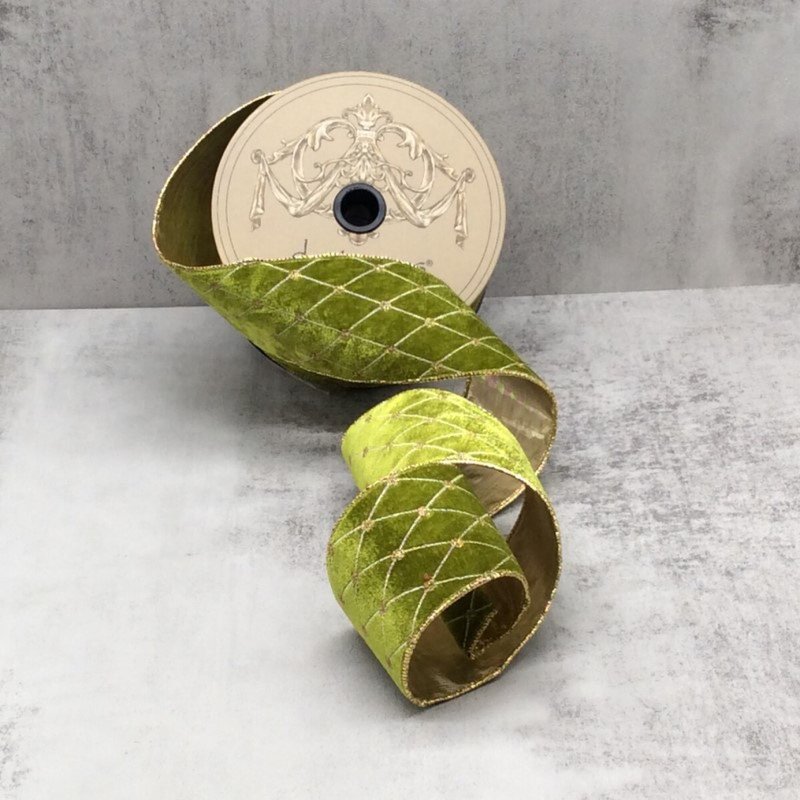 2.5 inch chartreuse velvet ribbon with gold diamond embroidery pattern on a spool.