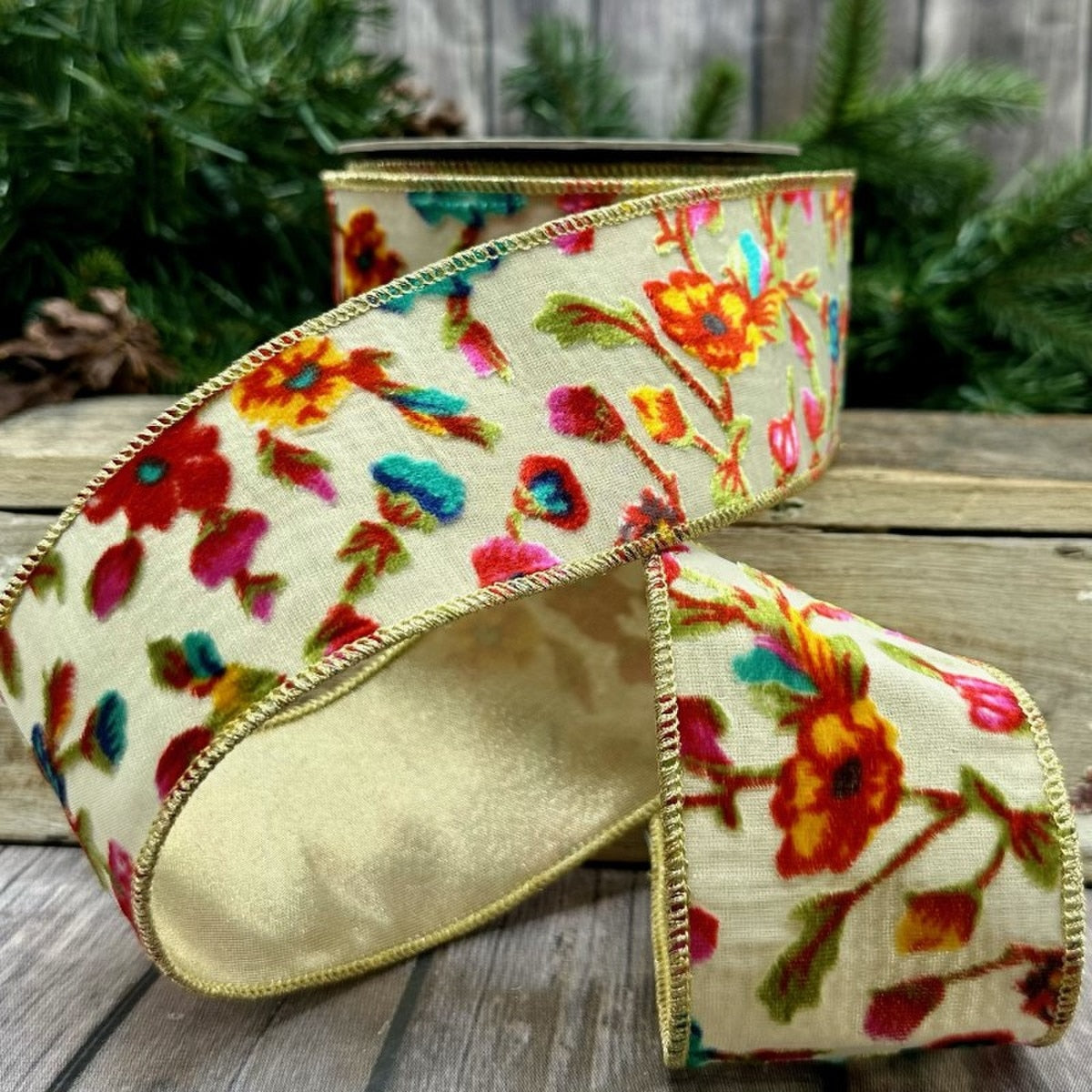 2.5 inch burnout velvet floral ribbon with hot pink, yellow, and teal flowers on a cream background.