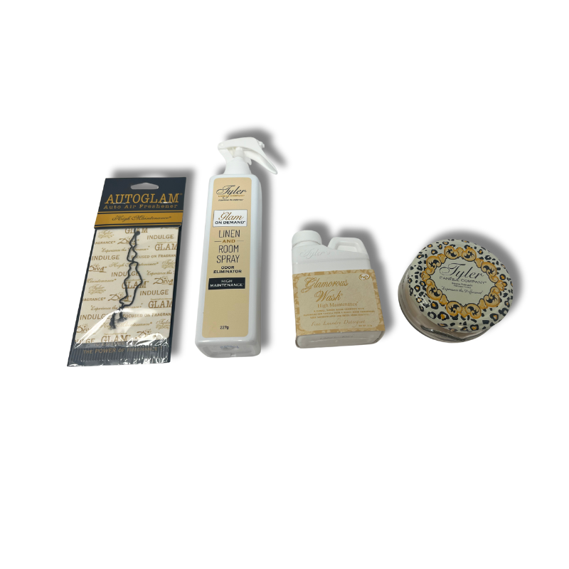 Glam Gift Suite VI containing a linen spray bottle, jar candle, wash packet, and car freshener.