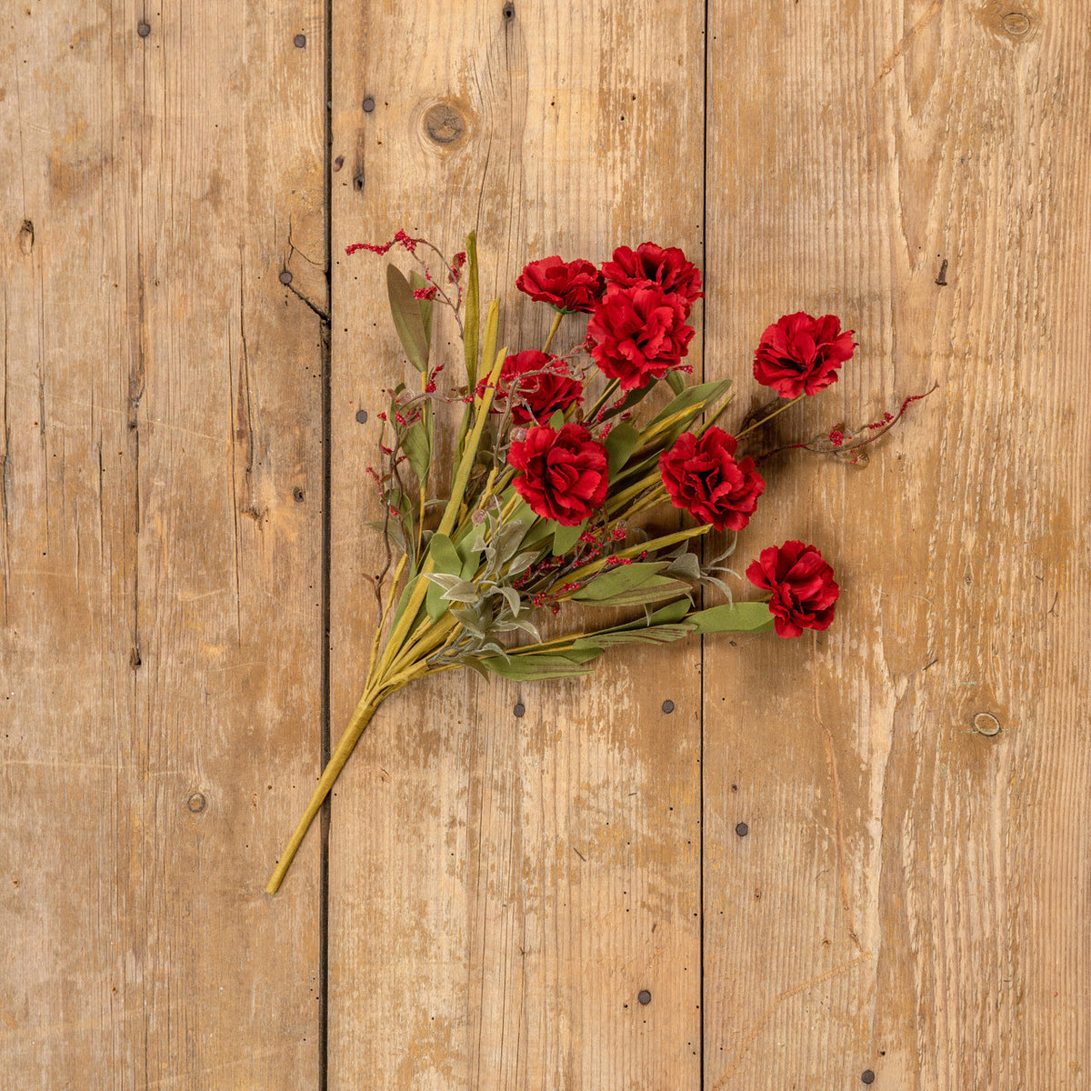 Artificial dark red camellia bush with mixed green foliage in a round silhouette.