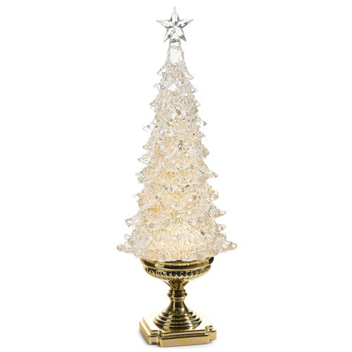 Artificial gold tree with swirling glitter particles on branches.