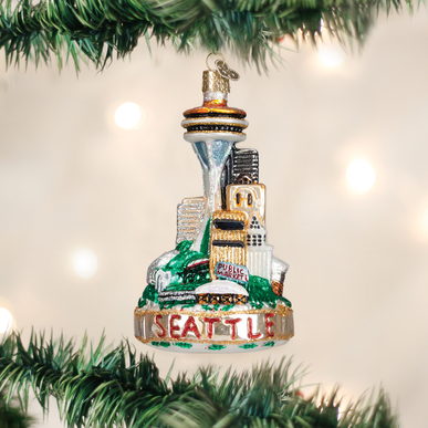 Glass ornament featuring Seattle landmarks including the Space Needle, Monorail, Pike Place Market, Smith Tower, and Experience Music Project.
