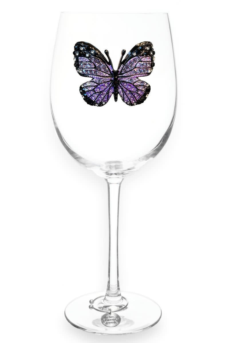 Purple stemmed wine glass with jeweled butterfly embellishments on the bowl.