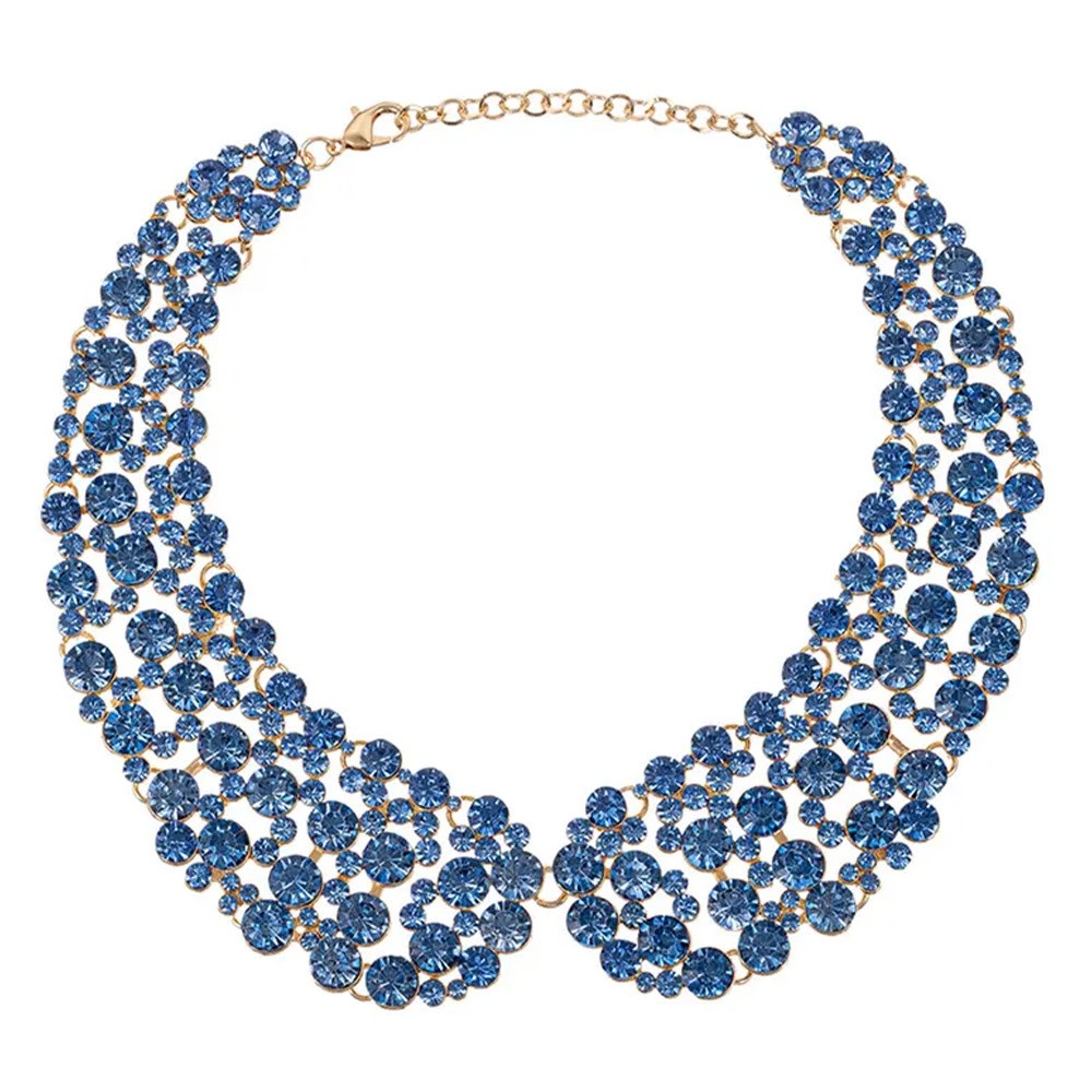 Exaggerated gold-tone collarbone chain necklace with sparkling blue glass crystal rhinestones.