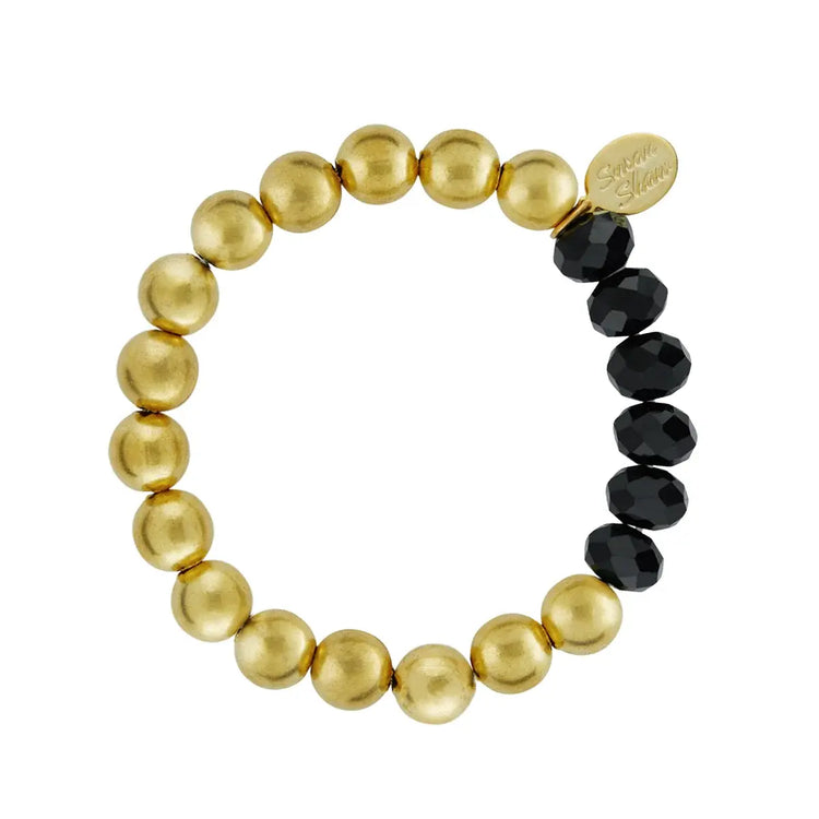 Triple-plated gold stretch bracelet featuring black crystal beads mixed with classic Margaret-style gold accents.