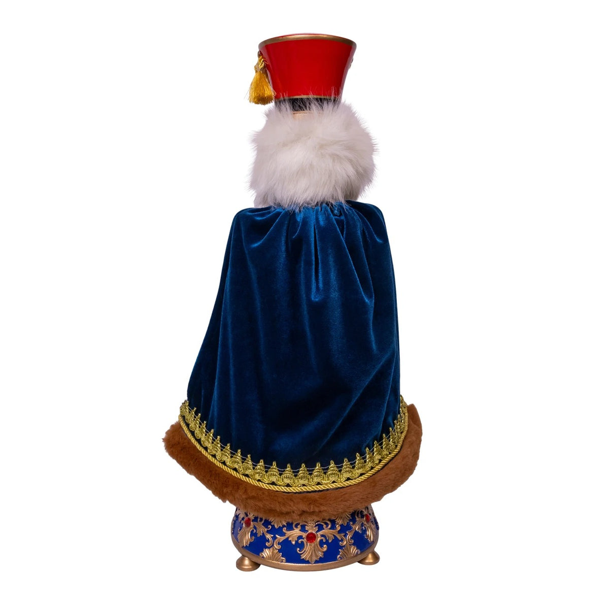 Back view of a 21-inch musical soldier nutcracker with a blue velvet cape and red hat.