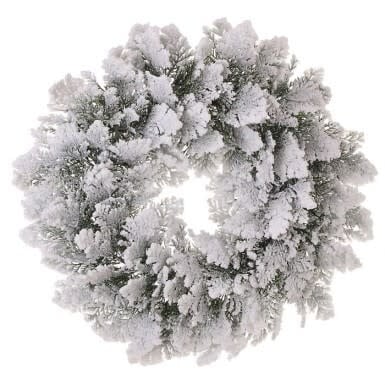A round cedar wreath covered in white faux snow with a natural brown silhouette.