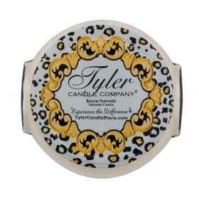 Glamfam candle in a clear glass jar with white soy-paraffin wax and citrus-rosewood fragrance.