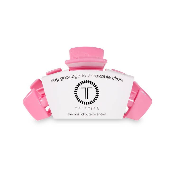 Medium hair clip with bendable teeth designed to hold thick to medium-thickness hair.