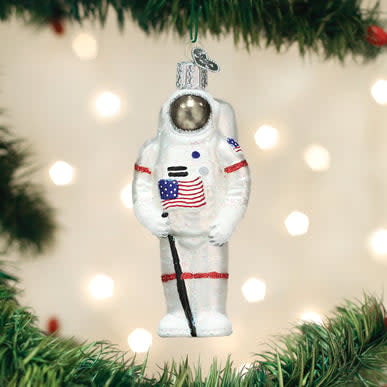 Astronaut ornament featuring a silver metallic astronaut figure in a white space suit with black boots and gloves.