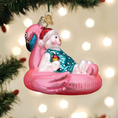 Glass snowman pool float ornament with silver accents on a blue background