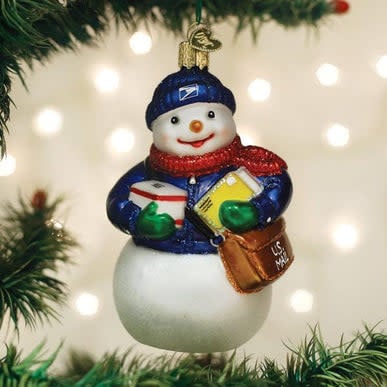 USPS snowman ornament with white body, black hat, red scarf, and blue boots.
