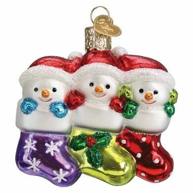 Snow Family Of 3 Ornament featuring three stylized figures in white snow texture with red accents.