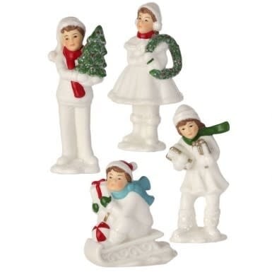 Porcelain figurine set depicting children in winter attire with a festive holiday theme.