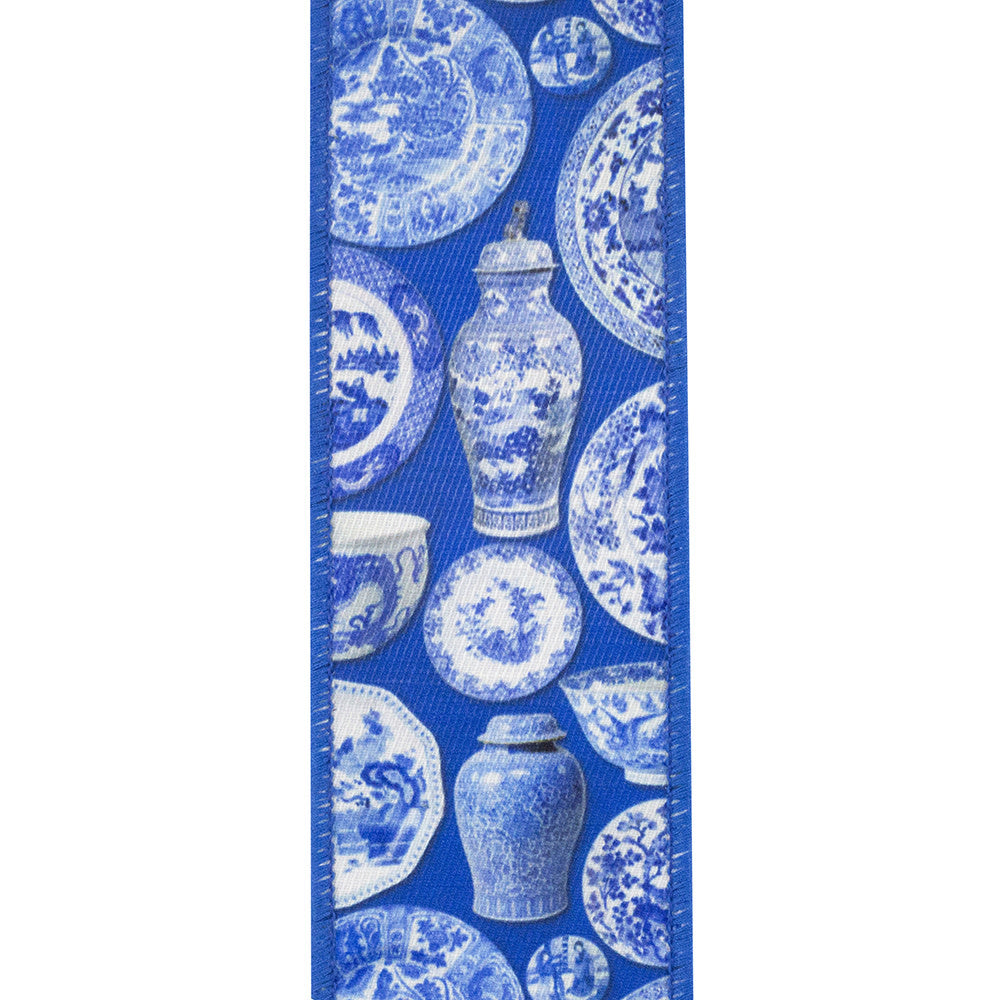 Blue and white chinoiserie patterned wired edge ribbon with ceramic vase and plate motifs.