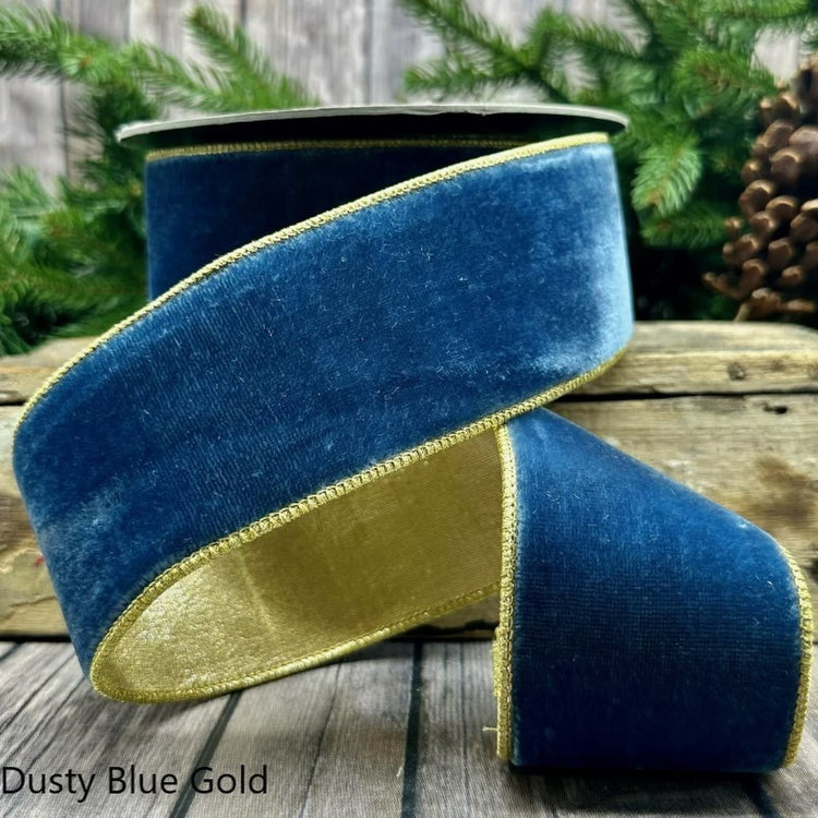 2.5-inch dusty blue velvet ribbon with gold metallic edges on a spool.