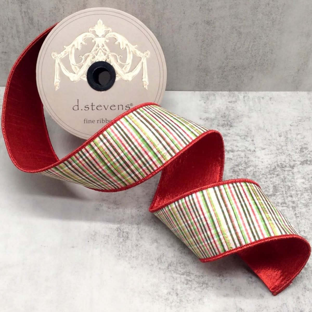 2.5-inch wide red, green, and white glitter striped plaid dupion ribbon on a d.stevens spool.