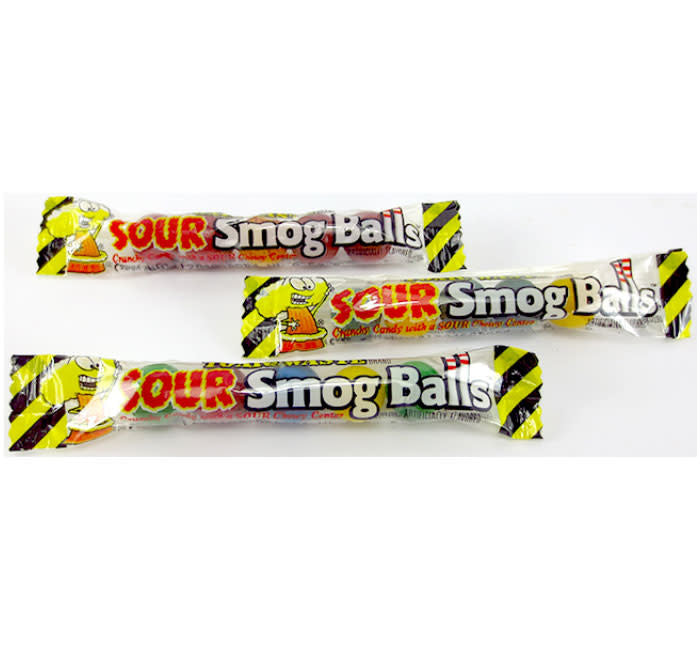 Bulk pack of Toxic Waste Sour Smog Balls shooter packs in dark packaging with green and purple branding.