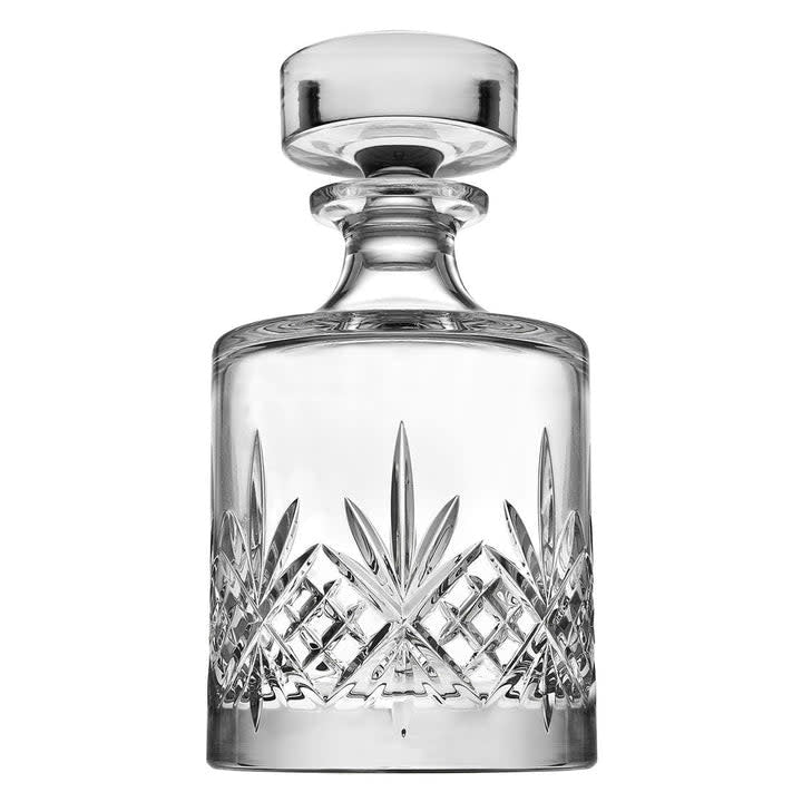 Clear unbleaded crystal round whiskey decanter with brilliant-cut pattern