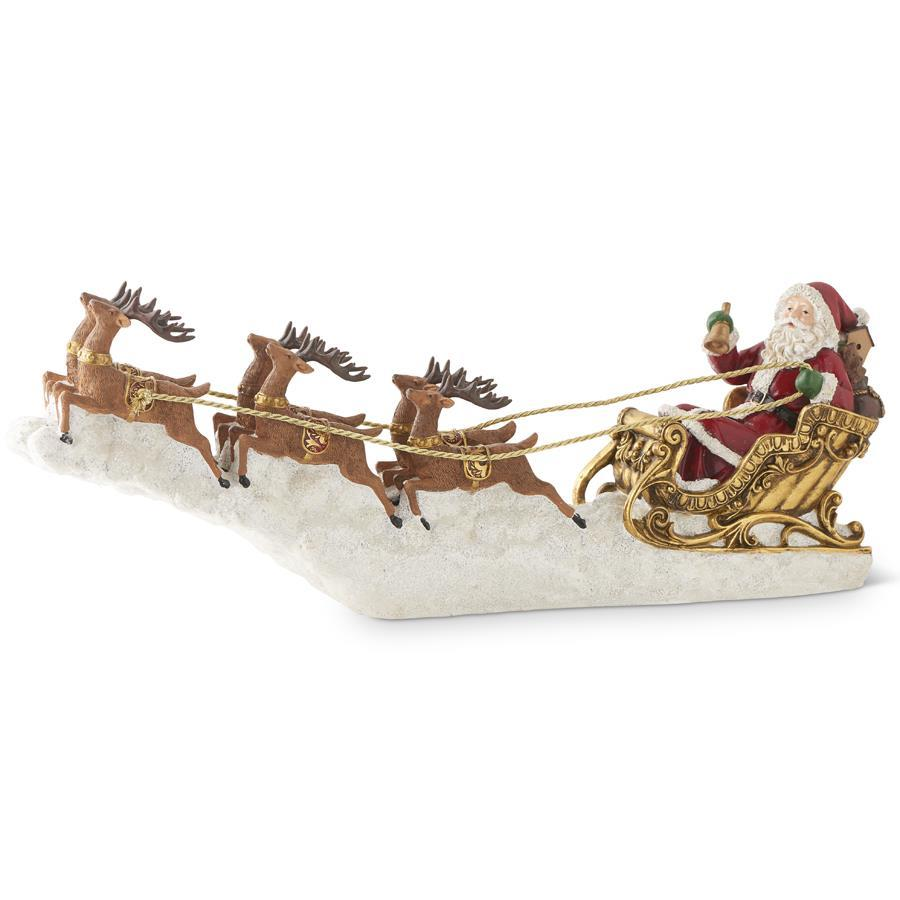 25-inch resin Santa Claus in an ornate gold sleigh pulled by six reindeer over a snowy base.