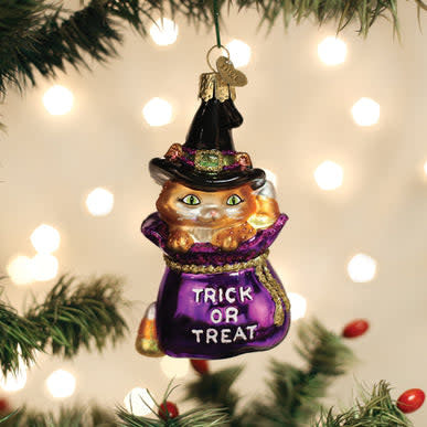 Halloween ornament shaped like a black kitten with orange accents.