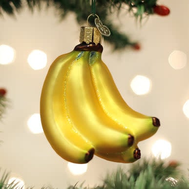 Banana bunch Christmas ornament with yellow fruit shapes on a green stem.