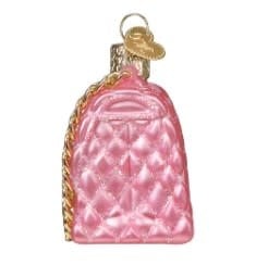 Quilted purse ornament in a neutral tone with stitched texture.