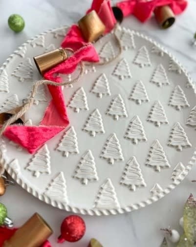 Round white stoneware Christmas platter with antique wash texture