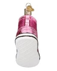 Black fashion sneaker ornament with white laces on a neutral background.