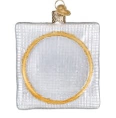 3.75-inch red Christmas cross-stitch ornament featuring a white snowflake pattern on fabric.