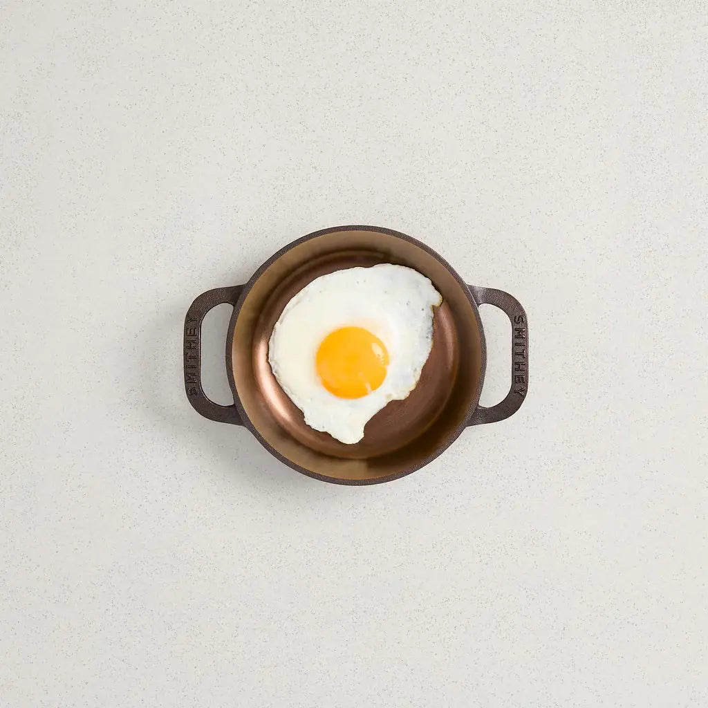 Satin-finish cast iron No. 6 dual handle skillet with pre-seasoned non-stick surface.