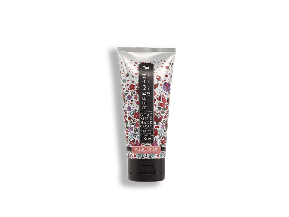 Beekman 1802 Honeyed Grapefruit goat milk hand cream in a floral patterned 2oz squeeze tube.