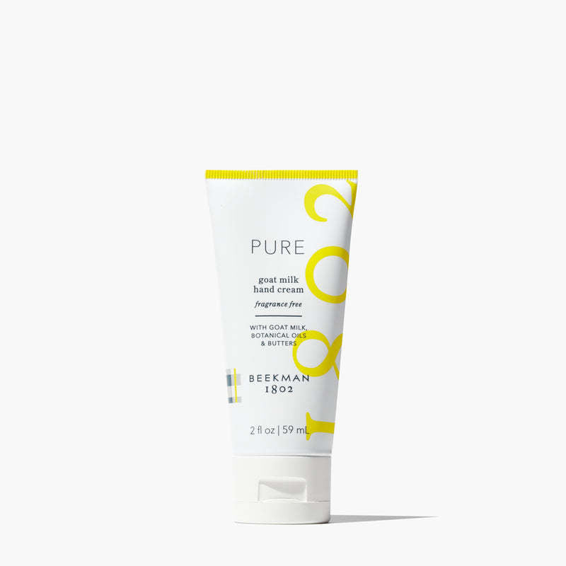 Beekman 1802 Pure goat milk hand cream in a white 2 oz squeeze tube with yellow branding.
