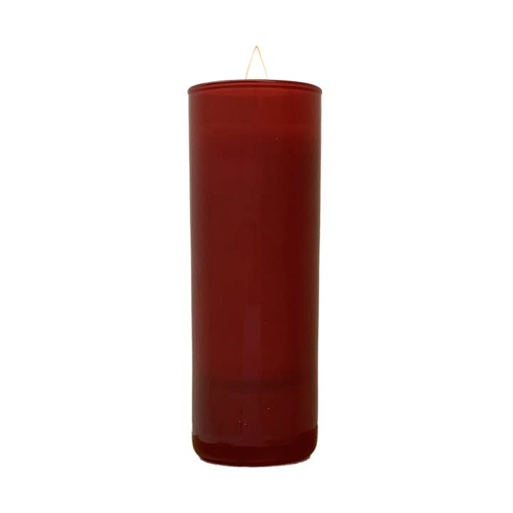Tall, slender 2 oz red votive candle in a cylindrical glass container with a lit wick.
