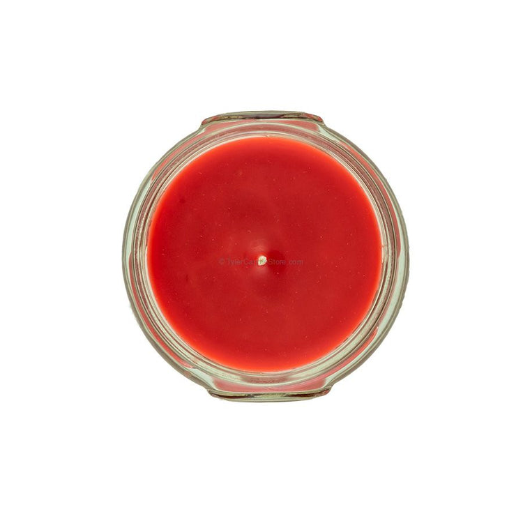 Top-down view of a 3.4oz red candle in a clear glass jar with a single centered wick.