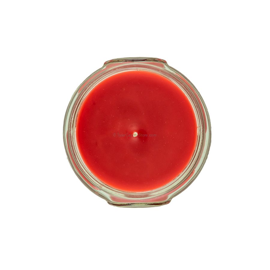 Top-down view of a 3.4oz red candle in a clear glass jar with a single centered wick.